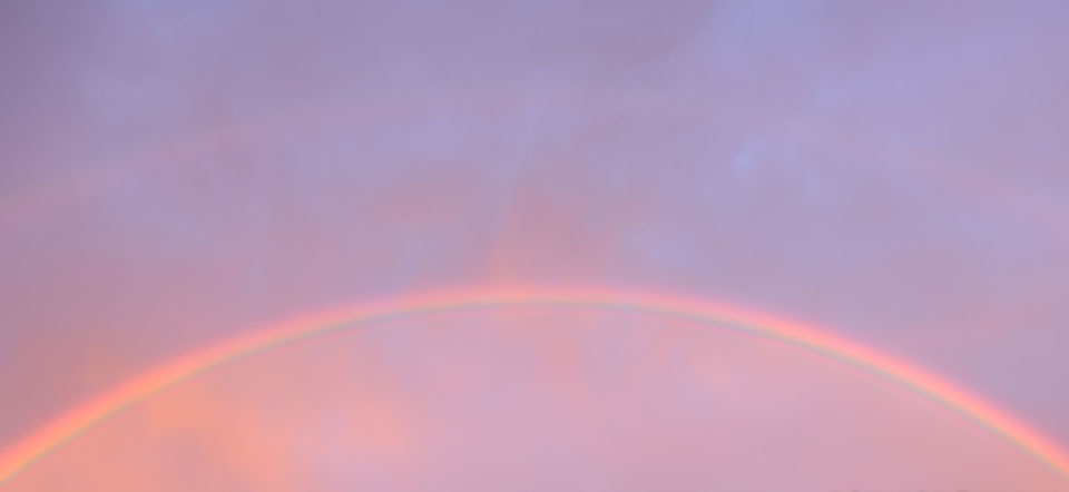 photograph of rainbow and sunrise over Hobart