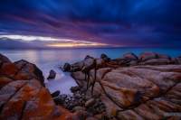 Dawn is rising on the east coast of Tasmania. The Bay of Fires has some of the most beautiful coastal scenery.