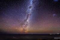 "Emu Rising" over the Tasman Sea. Milky Way at the Bay of Fires with airglow and a weak aurora.  The lights of Binalong Bay can be seen in the right of the image.