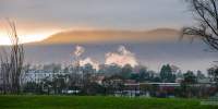 Winter morning over New Norfolk with fog and smoke from the paper factory down the river.