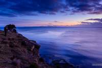 Photographer waiting for the light on top of the Fossil Cliffs on Maria Island.