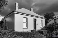 Black and white photo of a heritage cottage in Battery Point, Hobart.