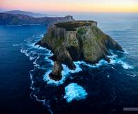 Tasman Island at dawn from the air. Cape Pillar is visible in the background.