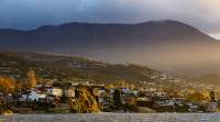 Late afternoon sun over Sandy Bay with kunanyi / Mount Wellington in the background. The image was shot from Nutgrove Beach.