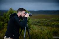 Photographer Daniel Johnson in action in the Tarkine.